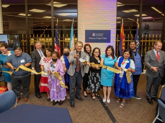 people cutting a ribbon at the Pascua Yaqui Tribe Microcampus